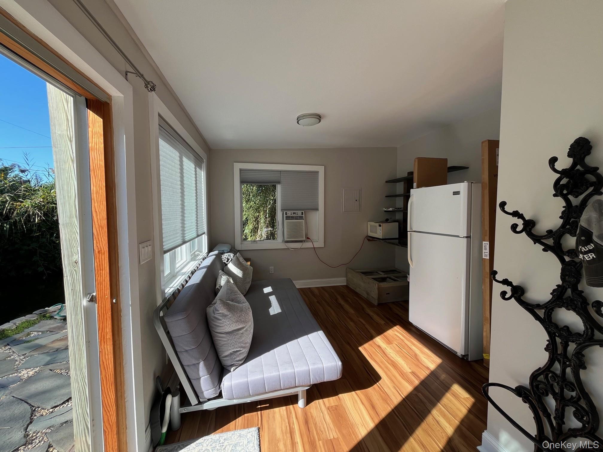 150 Clipper Way Ocean Beach, NY 11770 - Photo 20 of 27 a living room with furniture and a window