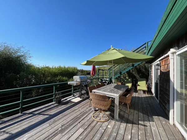 a view of deck with wooden floor and outdoor seating