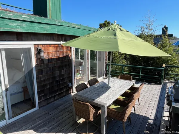 a patio with table and chairs