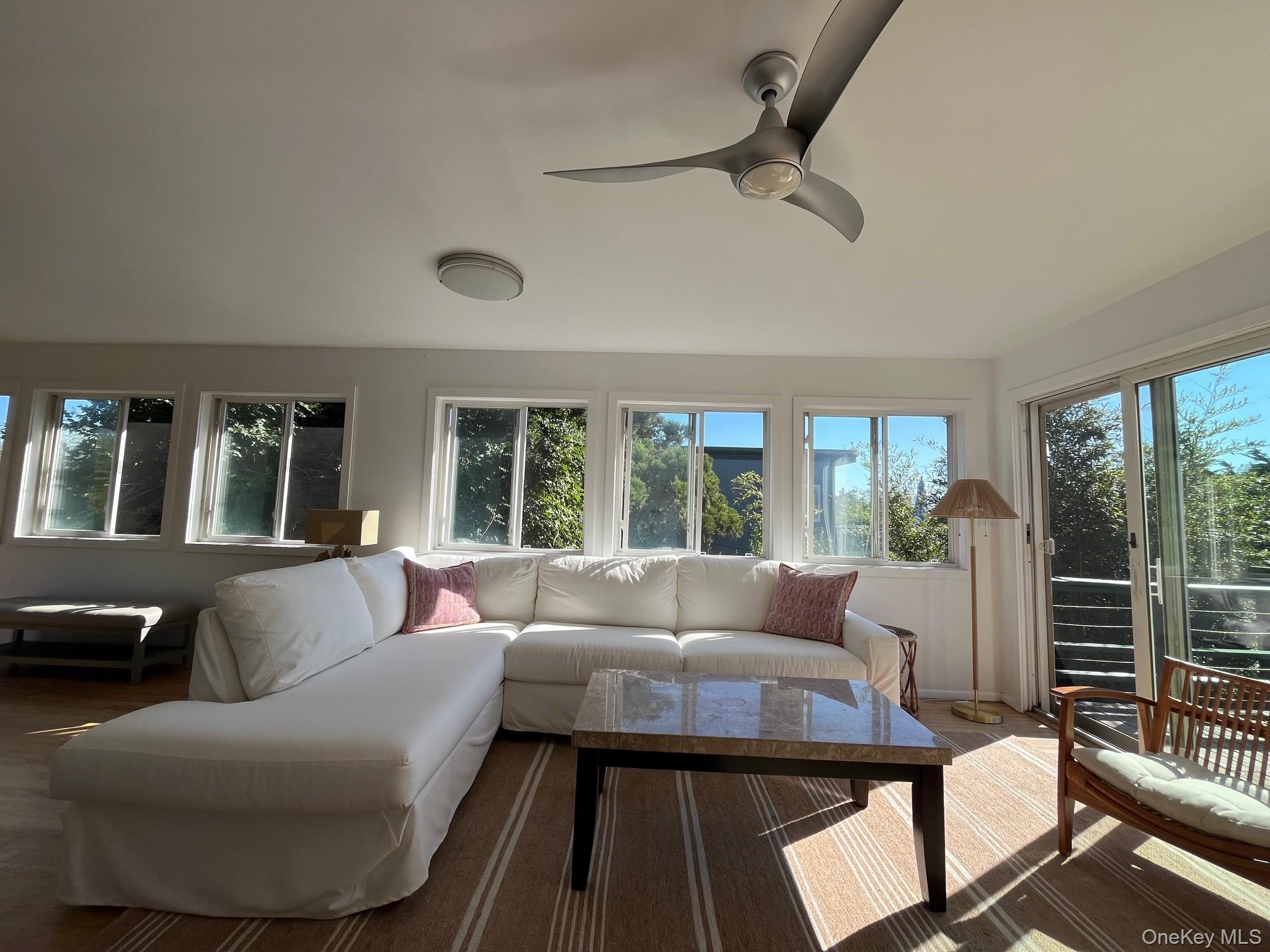 150 Clipper Way Ocean Beach, NY 11770 - Photo 3 of 27 a living room with furniture and a large window