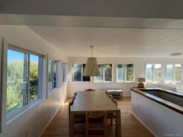 a view of a dining room with furniture window and outside view