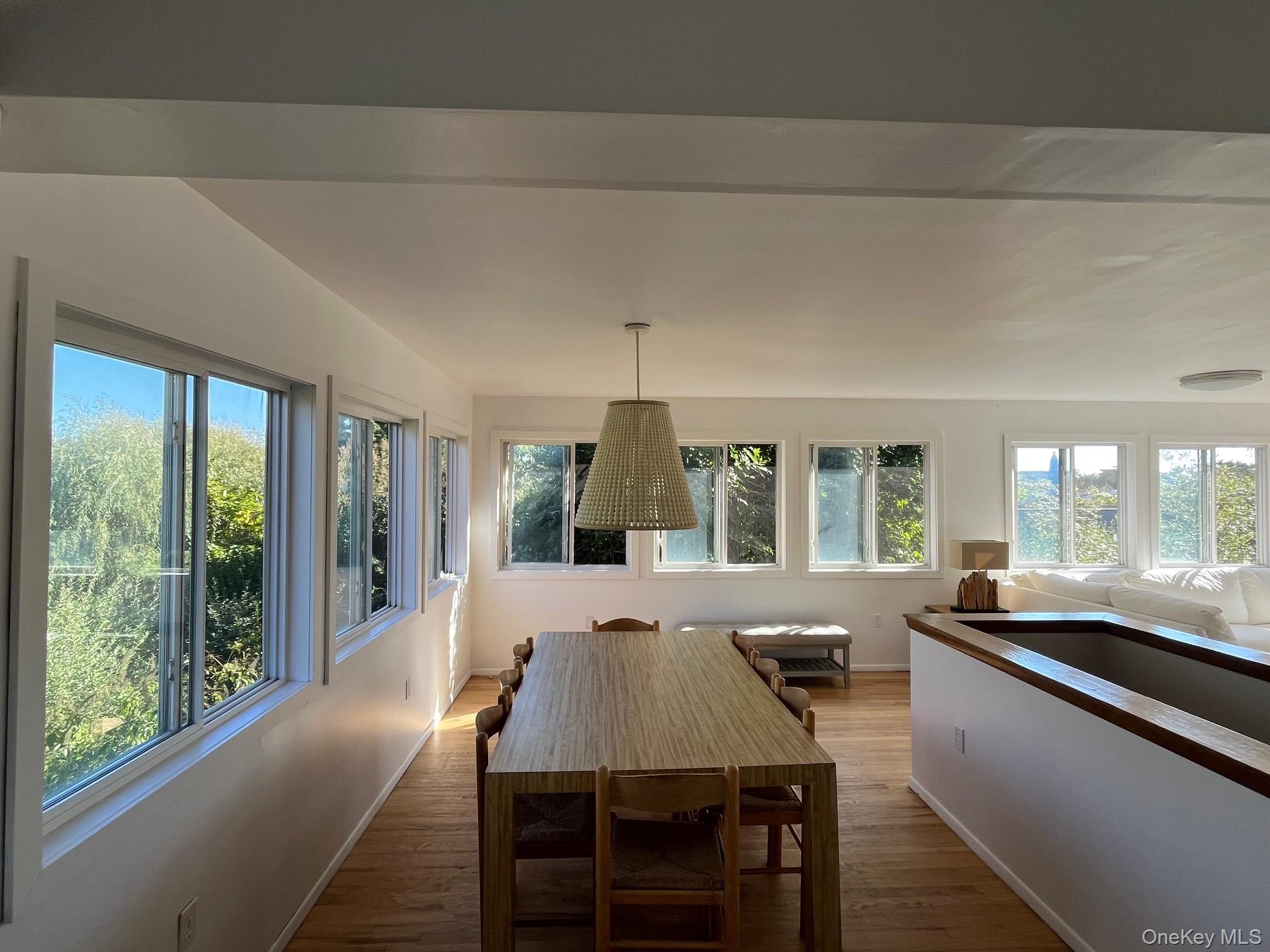 150 Clipper Way Ocean Beach, NY 11770 - Photo 5 of 27 a view of a dining room with furniture window and outside view