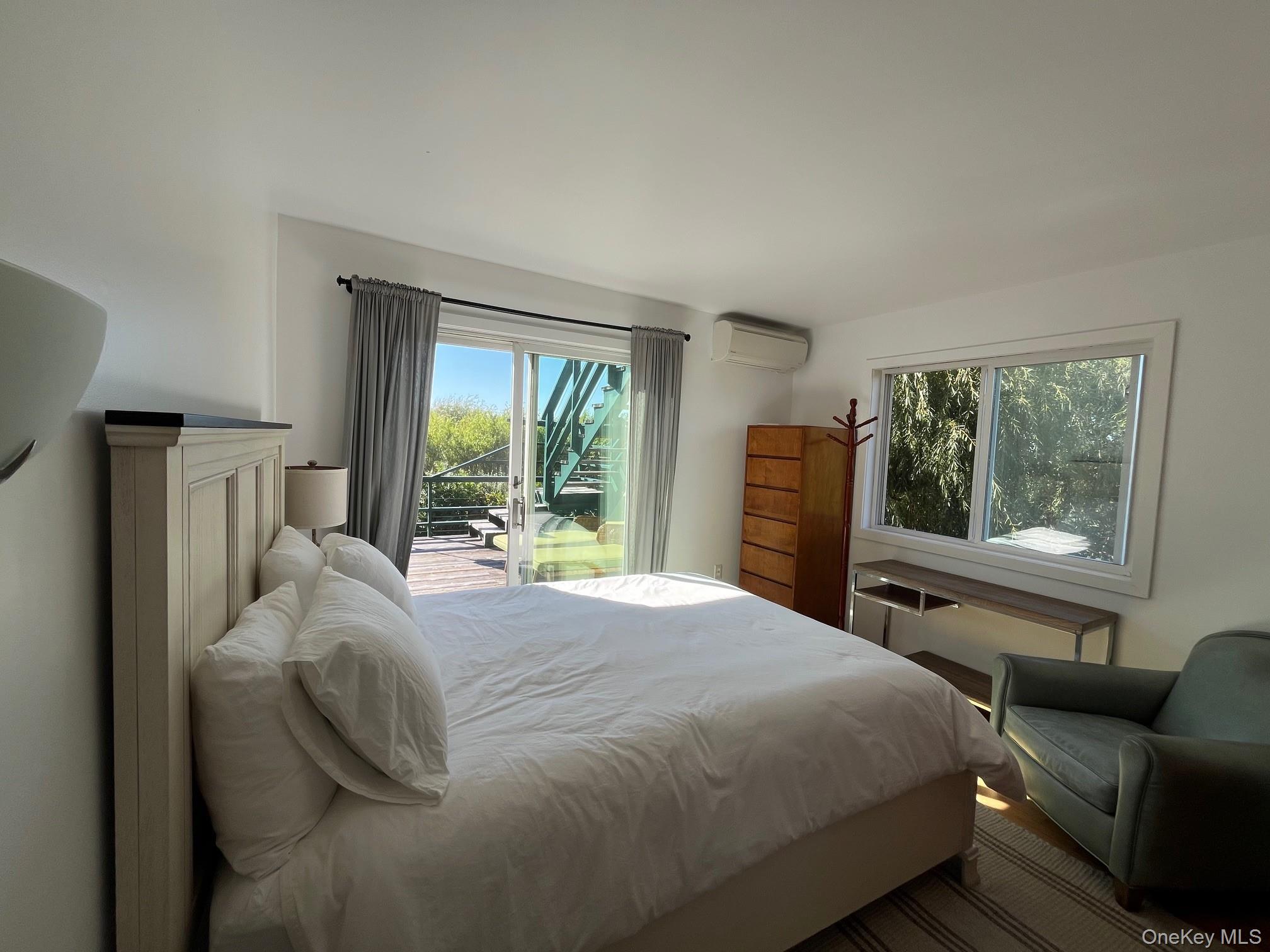 150 Clipper Way Ocean Beach, NY 11770 - Photo 8 of 27 a bed sitting in a bedroom next to a window