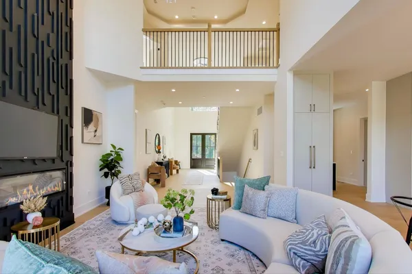a view of an empty room with a cabinet and a window