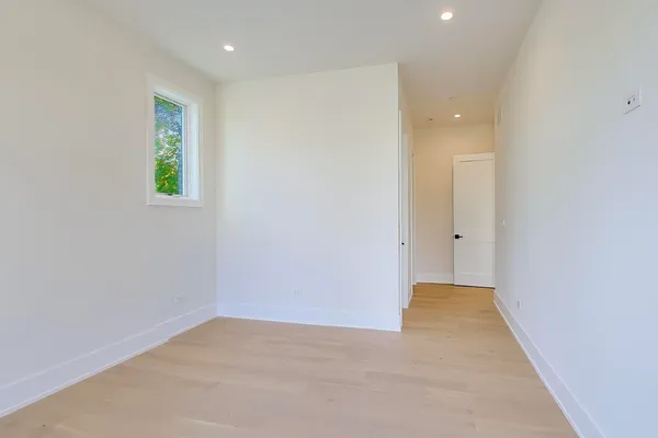 a view of hallway with a rug and a tub