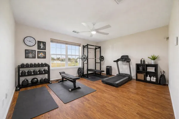 a room with furniture and gym equipment