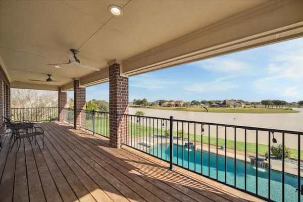 a view of balcony with wooden floor