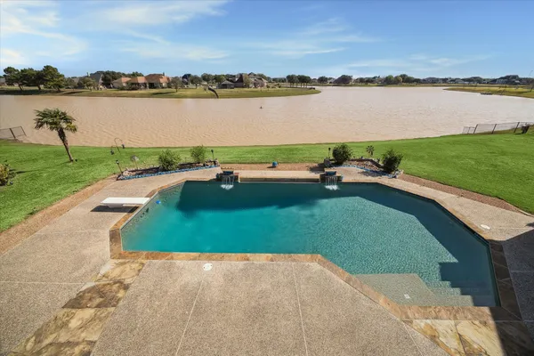 a view of a lake with houses in the back