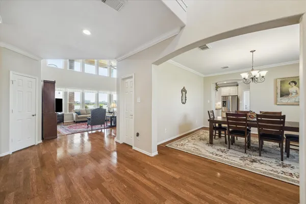 a view of a dining room with furniture window and wooden floor
