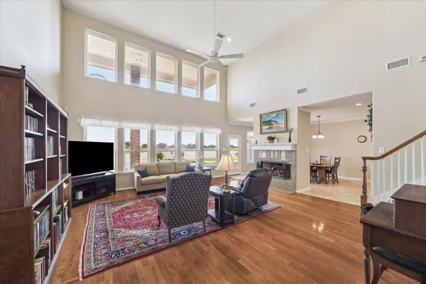 a living room with fireplace furniture and a flat screen tv
