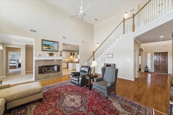 a living room with furniture and fireplace