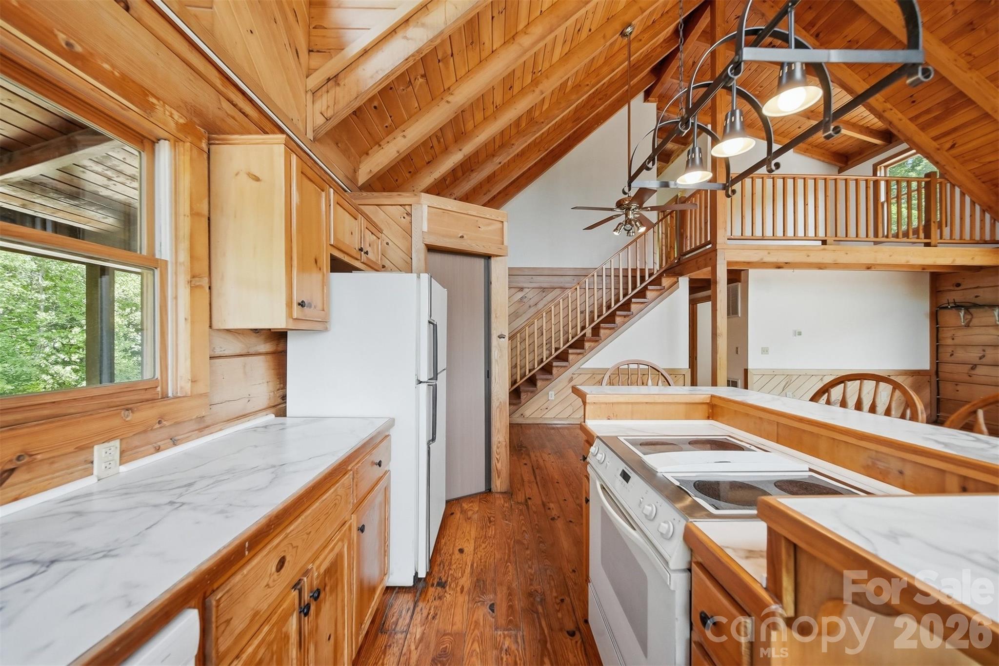 2079 Icard Ridge Road Taylorsville, NC 28681 - Photo 18 of 48 a view of a kitchen with a sink and wooden floor