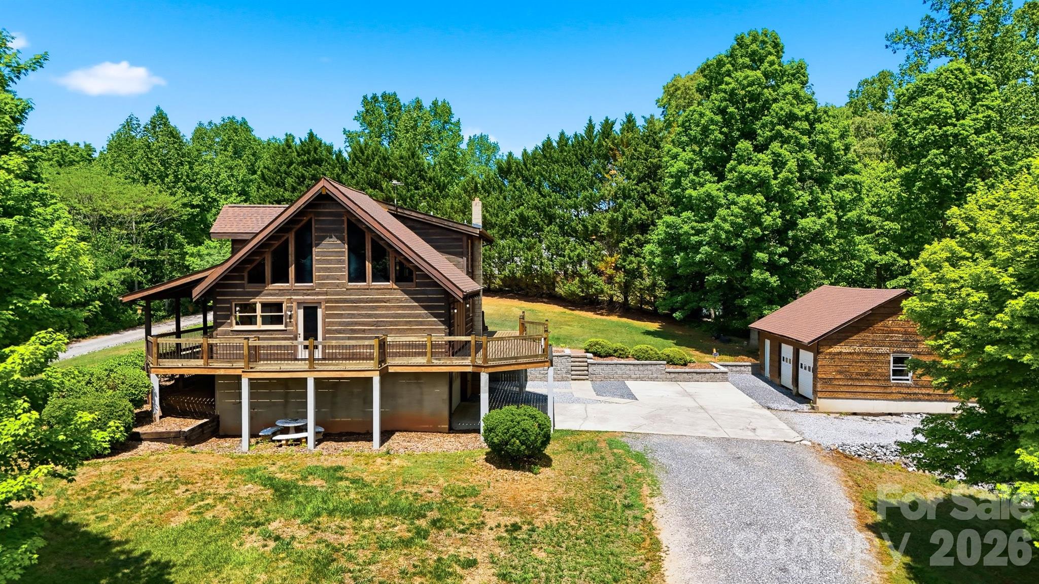 2079 Icard Ridge Road Taylorsville, NC 28681 - Photo 2 of 48 a view of a house with yard and sitting area
