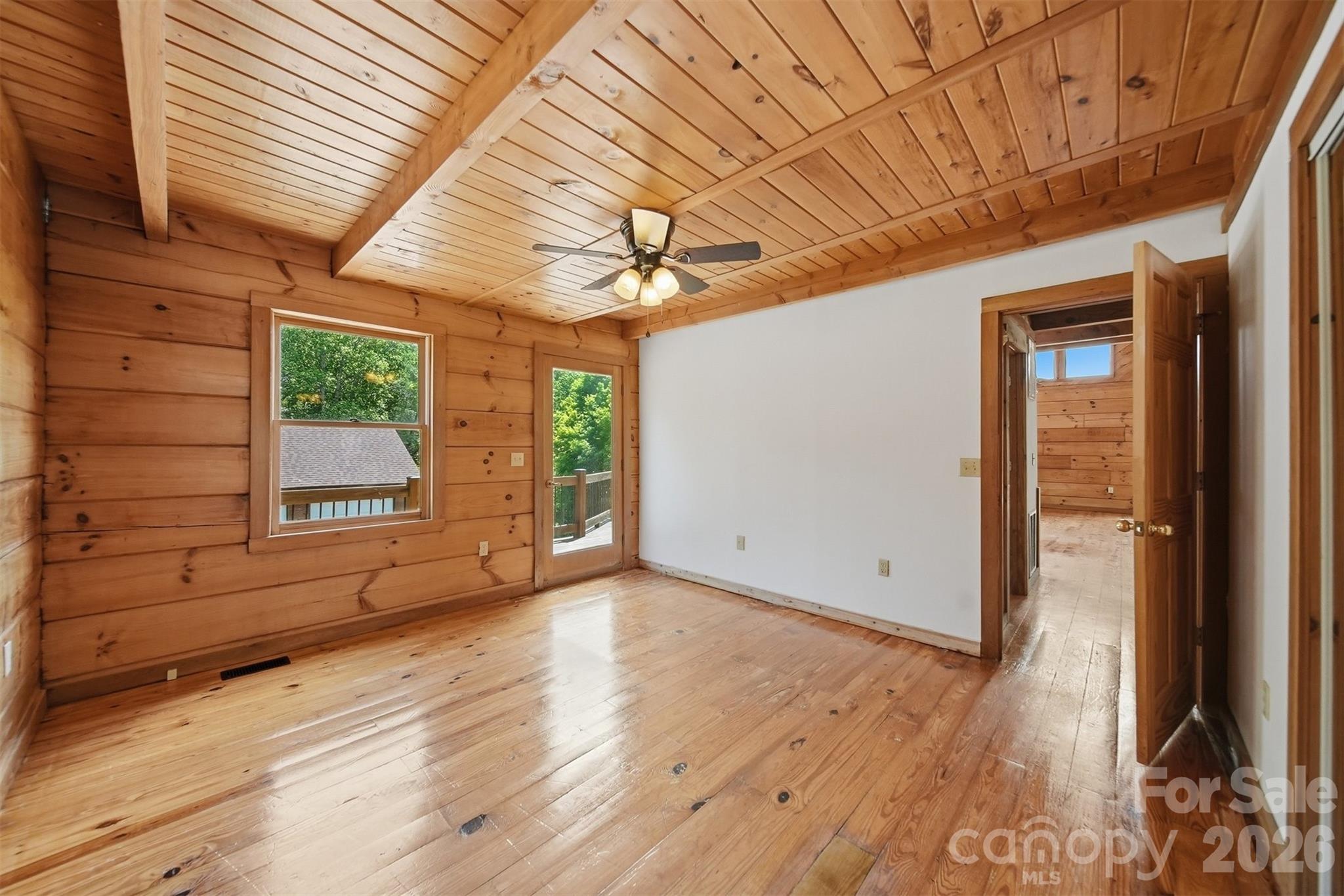 2079 Icard Ridge Road Taylorsville, NC 28681 - Photo 25 of 48 a view of an empty room with wooden floor and a window
