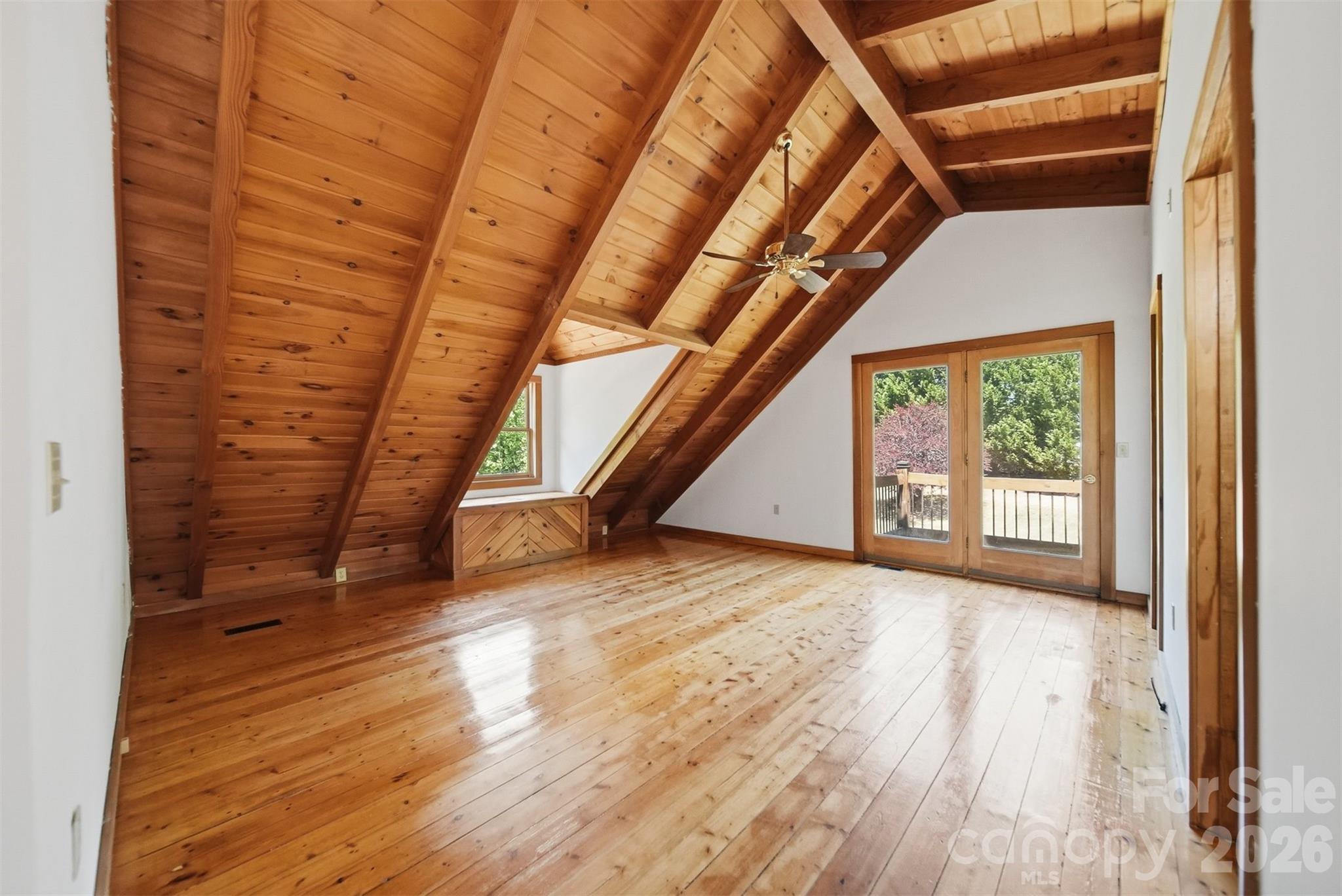 2079 Icard Ridge Road Taylorsville, NC 28681 - Photo 34 of 48 a view of an empty room with wooden floor and a window