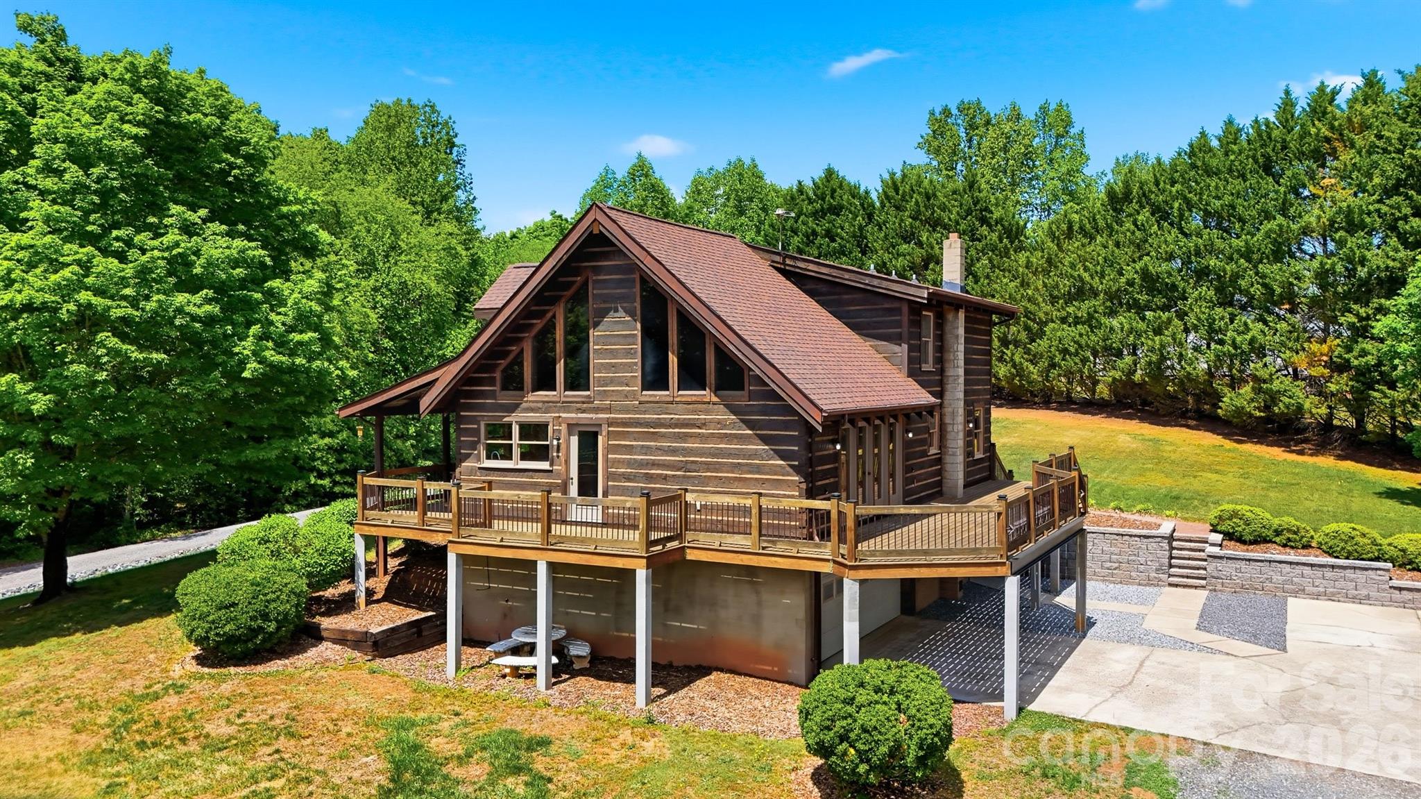 2079 Icard Ridge Road Taylorsville, NC 28681 - Photo 47 of 48 a view of a house with a yard