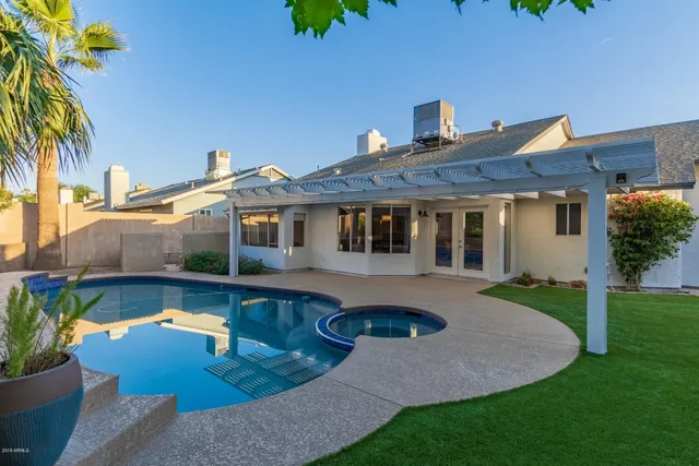 a front view of a house with swimming pool