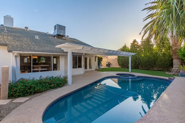 a front view of a house with swimming pool