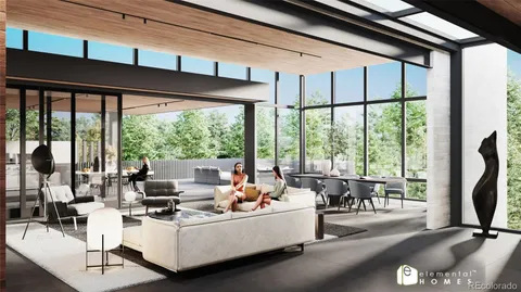 a living room with furniture tv and large windows