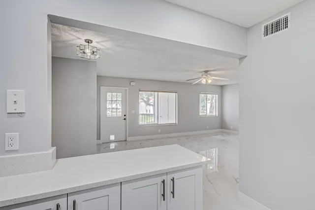 a view of a bathroom with a sink and a mirror