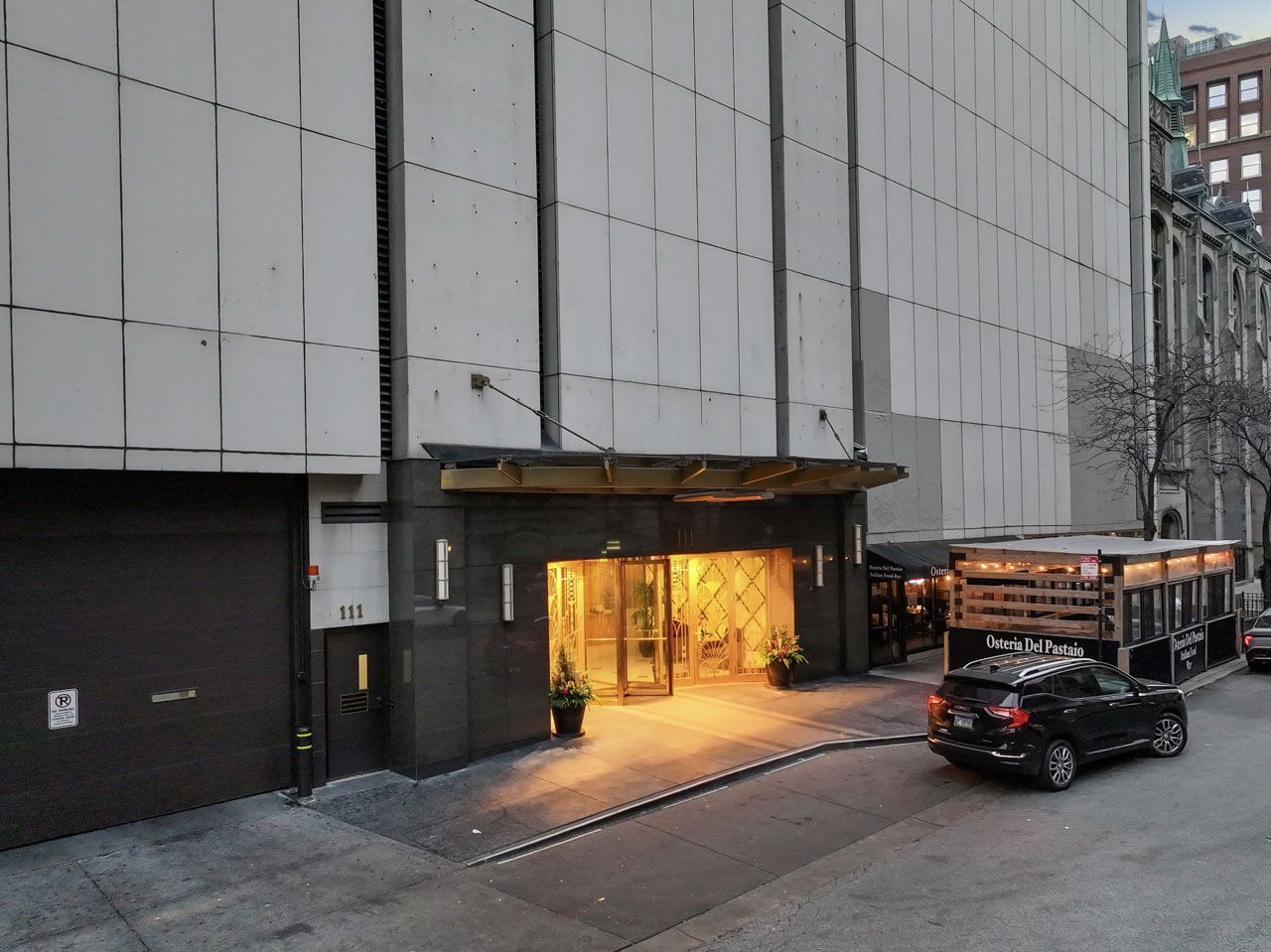 111 East Chestnut Street, Unit 28J Chicago, IL 60611 - Photo 2 of 36 a car parked in front of a building