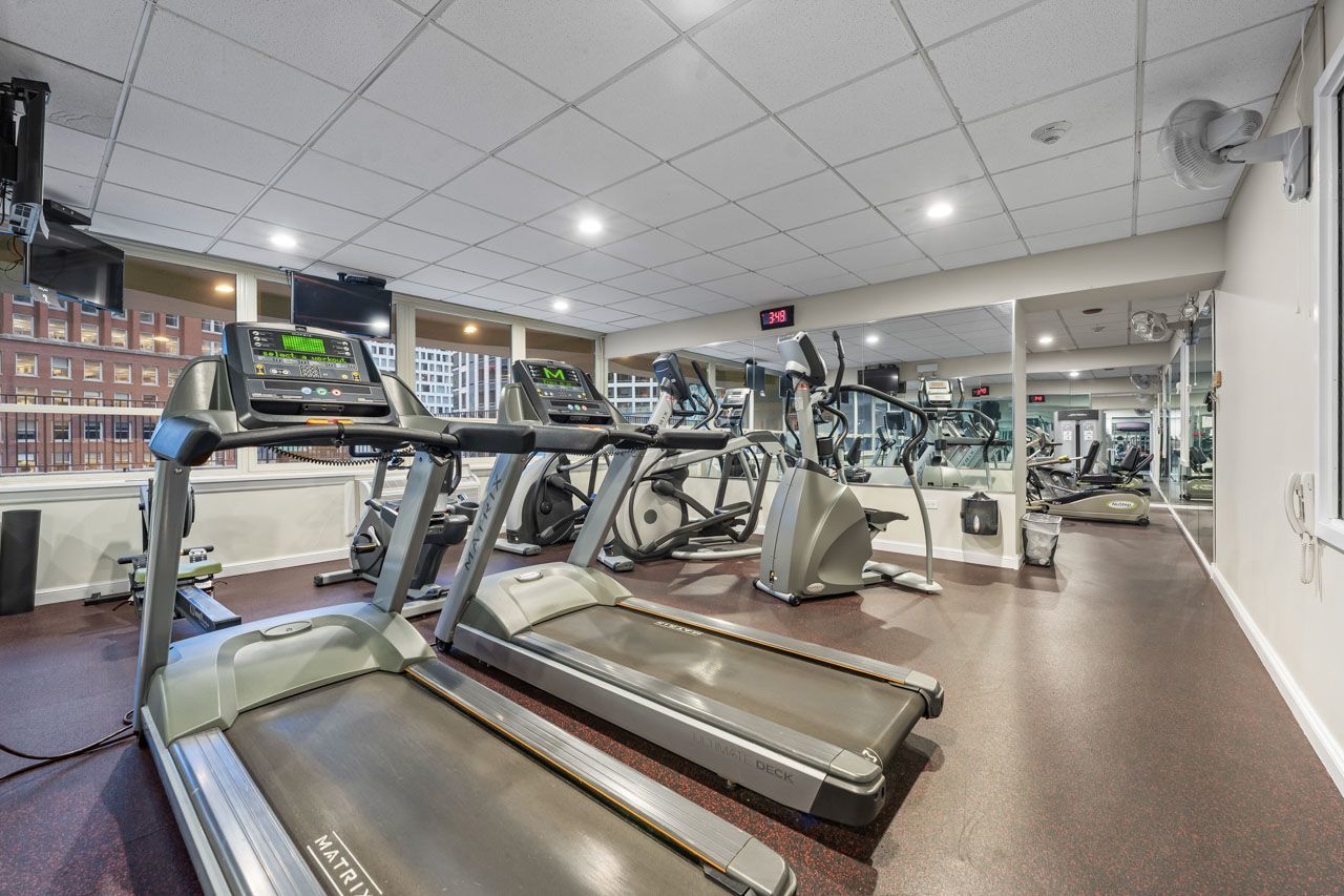 111 East Chestnut Street, Unit 28J Chicago, IL 60611 - Photo 30 of 36 a view of a room with gym equipment