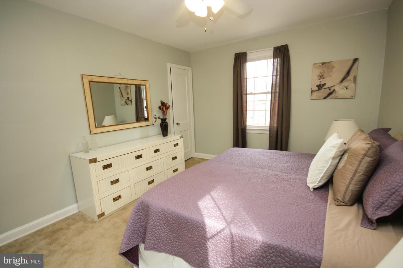 9110 Eton Road Silver Spring, MD 20901 - Photo 14 of 30 a bedroom with a bed and a window