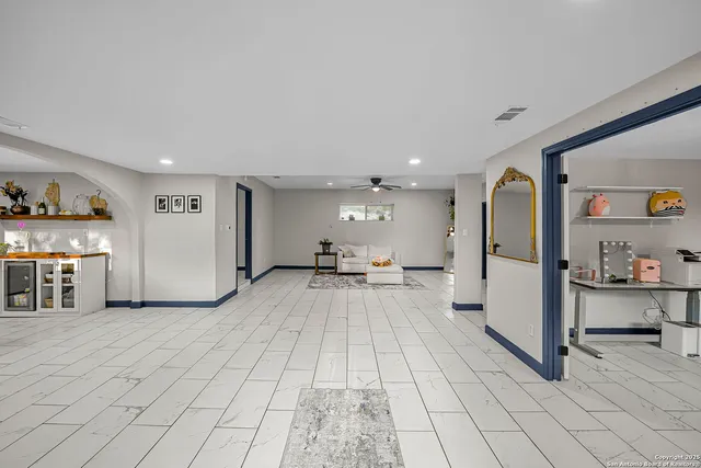 a view of a kitchen with furniture and a large window