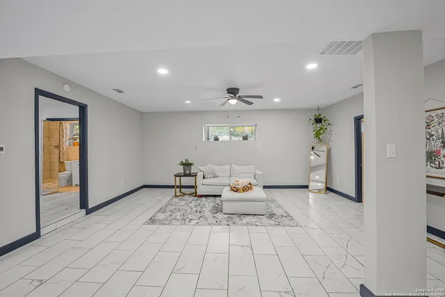 a view of livingroom with furniture and window