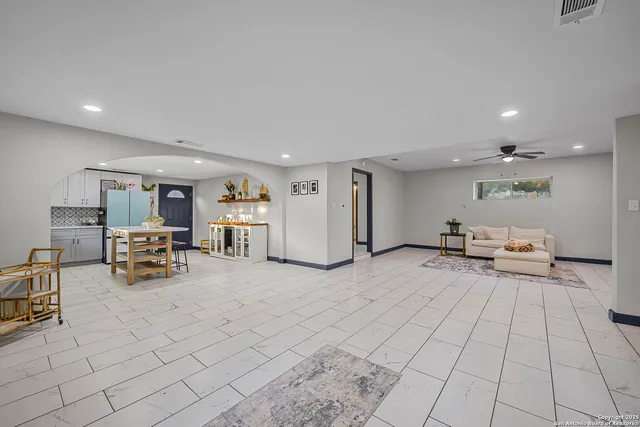 a view of a room with gym equipment and mountain view