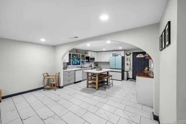 a view of a kitchen and dining room