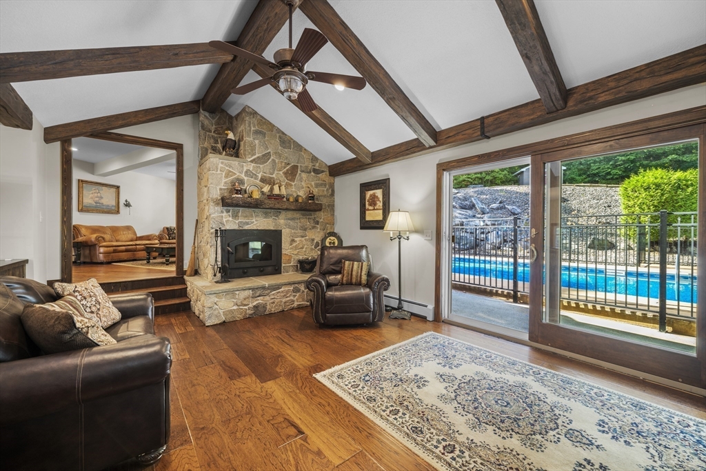235 James Street Ludlow, MA 01056 - Photo 13 of 41 a living room with furniture and a fireplace