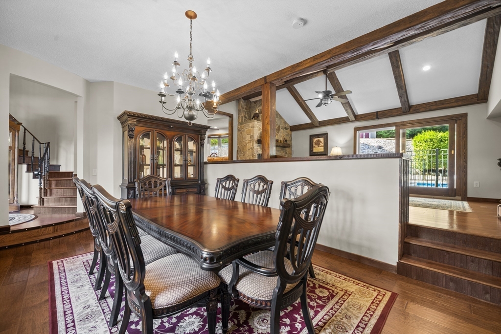 235 James Street Ludlow, MA 01056 - Photo 16 of 41 a dining room with furniture a chandelier and wooden floor