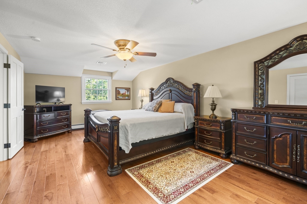 235 James Street Ludlow, MA 01056 - Photo 23 of 41 a bedroom with a bed dresser and a wooden floor