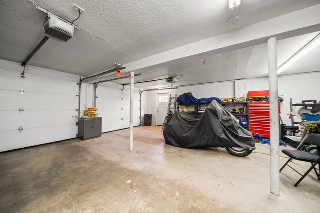 a view of a garage with furniture and other items