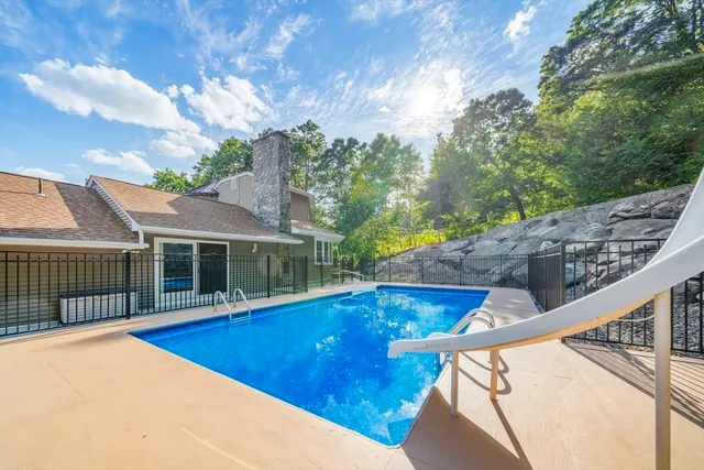 a view of a house with swimming pool