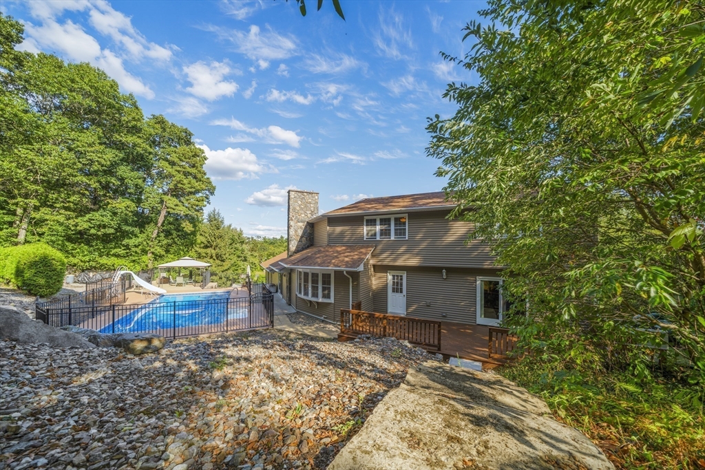 235 James Street Ludlow, MA 01056 - Photo 35 of 41 a front view of house with yard and trees in the background