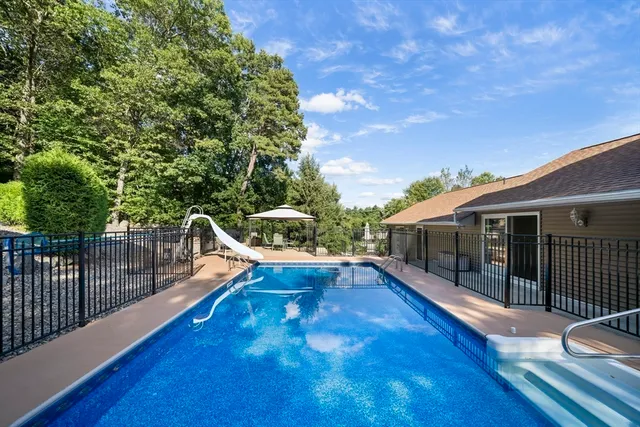 a view of a roof deck with wooden floor and fence