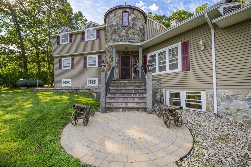 235 James Street Ludlow, MA 01056 - Photo 7 of 41 a view of a house with a yard chairs and plants