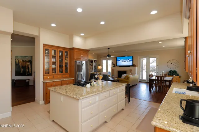 a living room with fireplace furniture and a view of living room