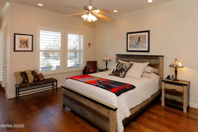 a bedroom with bed and a chandelier