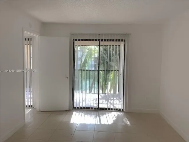 a view of a room with large windows