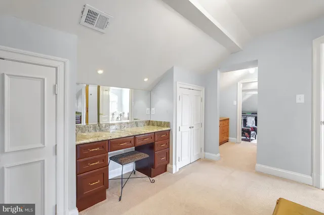 a view of a kitchen cabinets and dining room