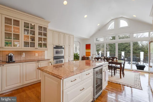 a kitchen with stainless steel appliances granite countertop a stove and cabinets