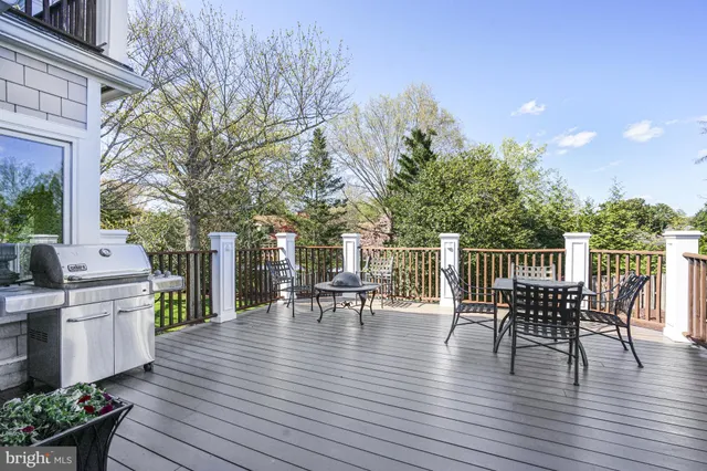 a view of a patio with table and chairs and wooden floor
