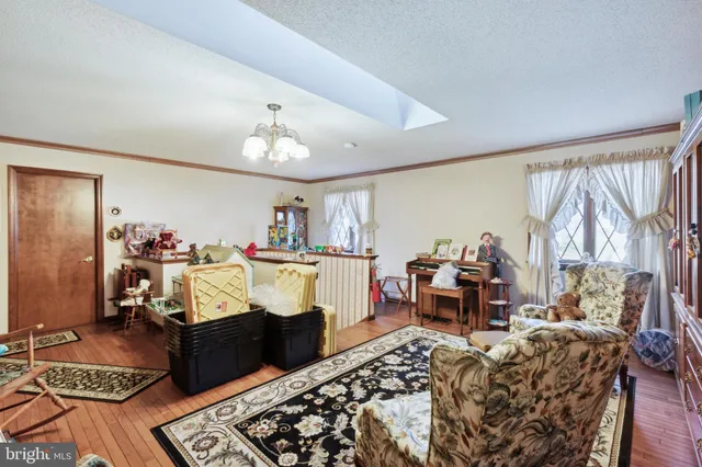 a bed room with a bed and a chandelier