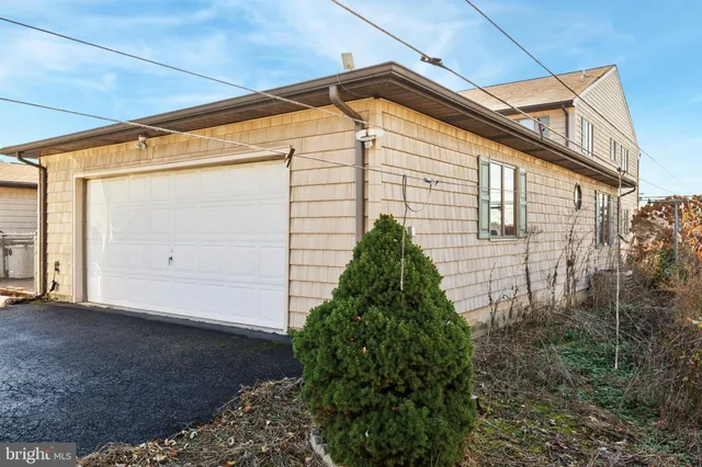 an aerial view of a house with a ocean view