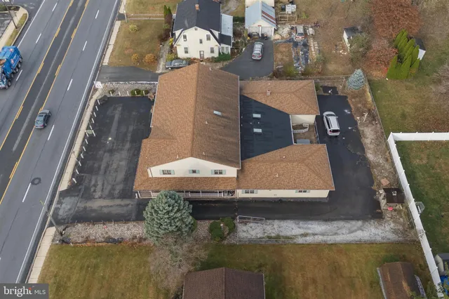 a aerial view of a house with a yard