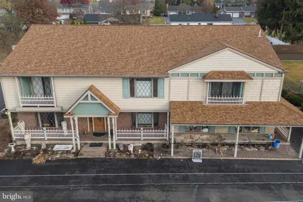 an aerial view of a house with a garden space