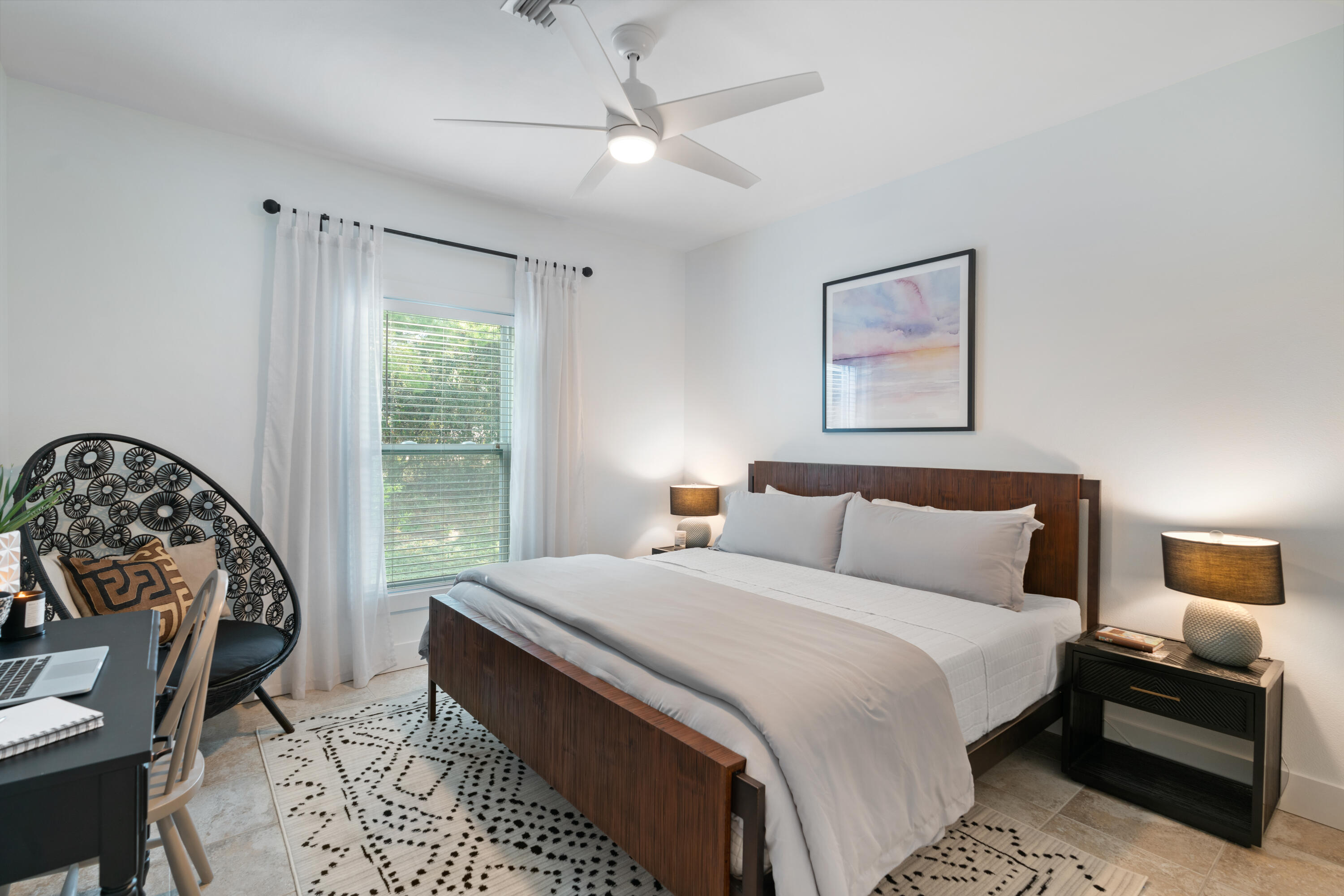 83 Brown Street Santa Rosa Beach, FL 32459 - Photo 16 of 42 a bedroom with a large bed and a large window